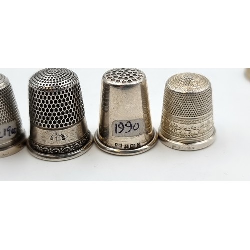 524 - A collection of six sterling silver thimbles. Of particular interest, a Thimble by the notable maker... 
