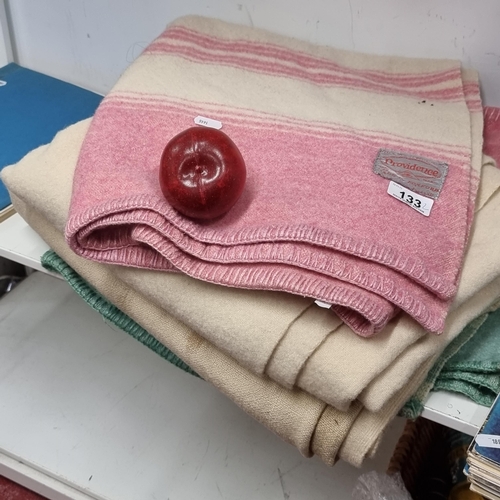 133 - Two Irish made vintage wool blankets, including a Providence Foxford example in shades of baby pink ... 