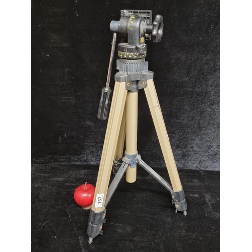 137 - A Bilora film camera tripod with stakes at the end of each leg for securing in the ground and a hand... 