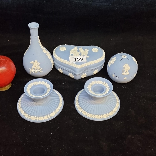 159 - A selection of five Wedgwood jasperware collectables. Including a matching pair of candlesticks with... 