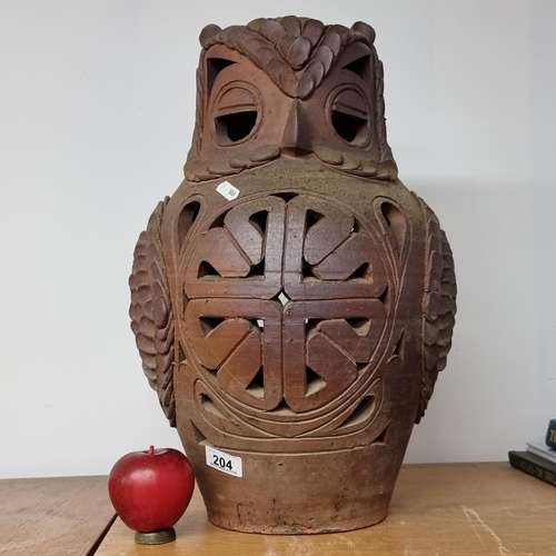 204 - A very striking  huge terracotta owl with pierced knot motifs and feather detail. Would look great w... 