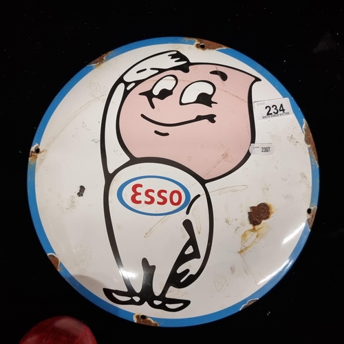 234 - A circular enamel sign advertising Esso featuring the iconic Esso Oil Drop Man.