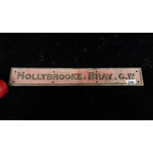 A very heavy original antique cast iron sign reading "Holly Brooke Bray C.W."