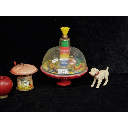 260 - Three vintage toys including a Chad Valley spinning top, a tin plate wind-up sound box and a clockwo... 