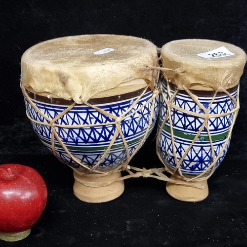 263 - A beautiful set of Moroccan terracotta Naqareh drums richly painted in shades of blue and green and ... 