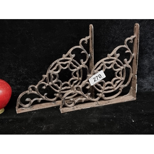 270 - Two cast metal shelf brackets with lovely curvlinear scroll design.