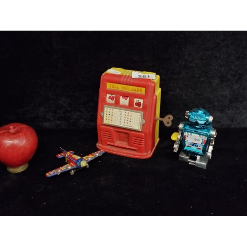 281 - Three vintage children's toys and collectables. Including a fantastic working Jackpot fruit machine,... 