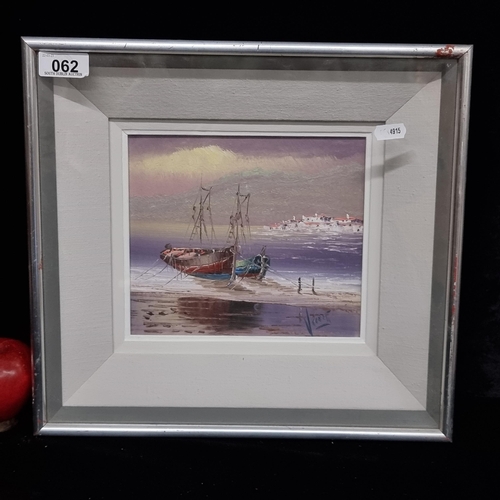 62 - A picturesque original oil on board painting featuring fishing boats moored on a sandy shore in suns... 