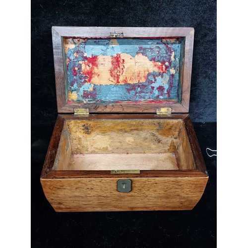 198 - An early Victorian Sarcophagus shaped oak caddy with a nice escutcheon detail. In very good conditio... 