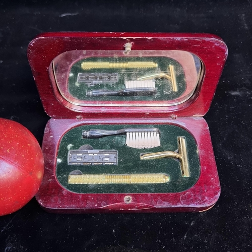 124 - A delightful vintage gentleman's travel shaving/toiletry set. This handsome wooden box contains an i... 