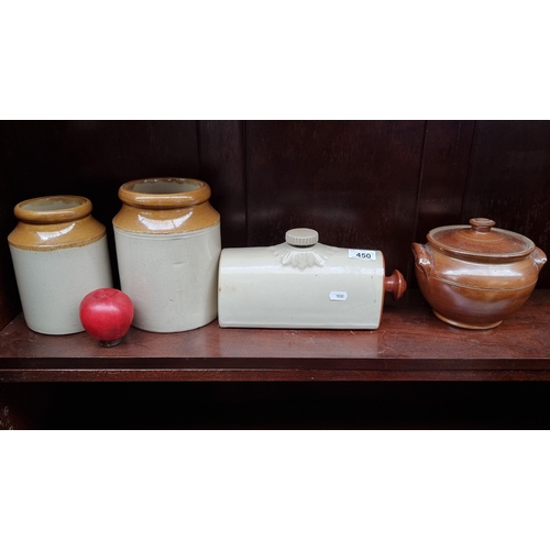 450 - Four stoneware pottery pieces including a bedwarmer and two graduating jars. With a lidded tureen.