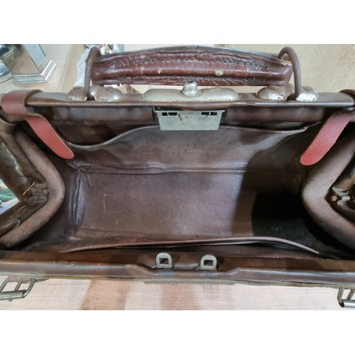 Sold at Auction: An impressive large antique leather Gladstone bag