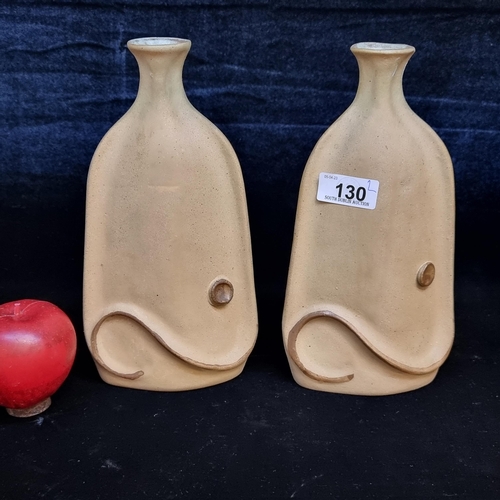 130 - A unique and stylish pair of Alka Malta earthenware bottle vases with abstract swirl and circular de... 