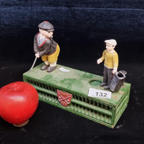 132 - A heavy cast metal money box featuring a golf team and an emblem reading 'Birdie Putt'. With gold cl... 