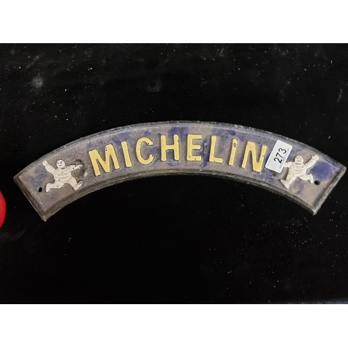 273 - A heavy cast metal Michelin sign. Hand-painted in a dark navy blue with a pale yellow text. L40cm