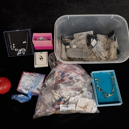 298 - A box containing a collection of costume jewellery including a Maci necklace and earring set, an Ind... 