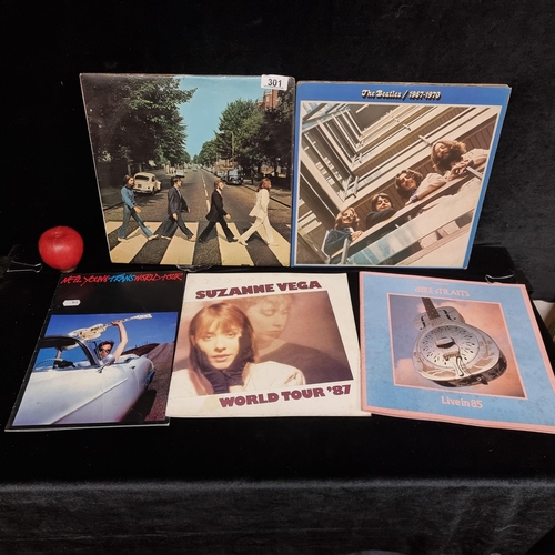 301 - Five items of musical interest consisting of two vinyl records of music by the Beatles including 'Ab... 