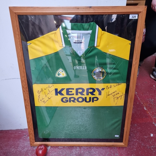 320 - A framed display of a signed GAA Kerry jersey shirt signed by Irish sporting heroes Kieran 