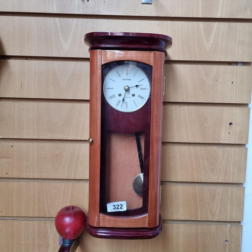 322 - A fabulous vintage Rythm Westminster 8 day wall clock with elegant clean design in two types of wood... 