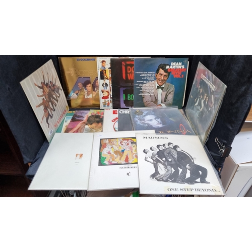 325 - 19  vintage vinyl album records including artists such as Madness x 3, Frankie goes to Hollywood, Pe... 