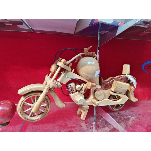 330 - A handmade wooden motorcycle ornament carved from albecia wood. From Gifts from Westberg. A stylish ... 