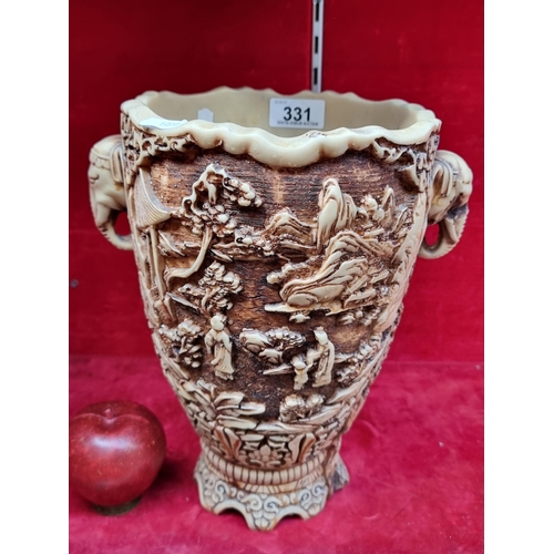 331 - A highly ornate and heavy quality vase with rich design featuring traditional Japanese scenes and el... 