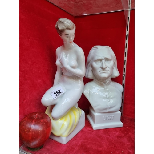 362 - Two porcelain statues including a bust of the composer Liszt and a crouching aphrodite figure.