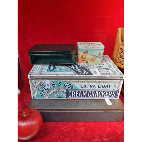 363 - Four antique storage tins including a Jacob's Cream Crackers branded example.