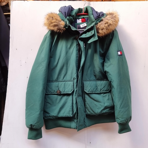 379 - A fabulous Tommy Hilfigur padded coat in a bright forest green with cuffed sleeves and bottom and lo... 