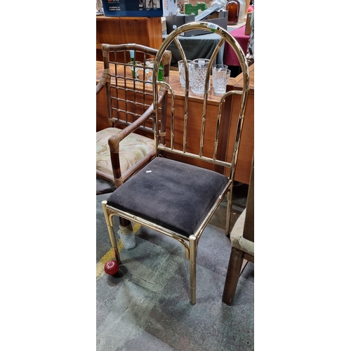 495 - A very lavish brass bamboo design chair with a padded plush seat in a dark brown shade.