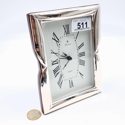 511 - A sterling silver cased clock, marked Quartz and featuring a bright white dial and Roman numeral fac... 