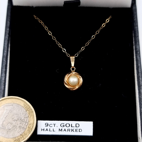 519 - A 9 carat gold drop pearl pendant necklace, set with a 9 carat gold chain. Length of chain: 46cm. To... 