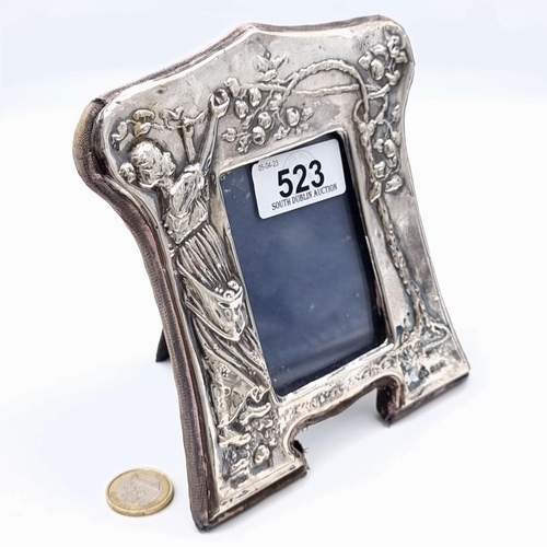 523 - A fine example of a sterling silver glazed photo frame, set with a Grecian grape and vine and figure... 