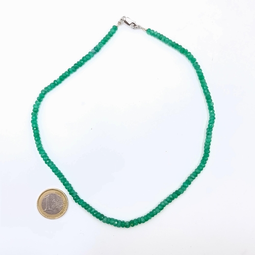 534 - A single strand natural Emerald gem stone necklace of 50 carats and featuring a sterling silver lobs... 