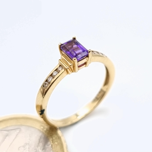 541 - Star lot : A very attractive 9 carat gold Amethyst and Diamond wide band set ring. Beautifull hue to... 