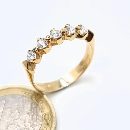 543 - A mesmerising 9 carat gold five stone Moissanite ring, set nicely on a wide band and showing import ... 