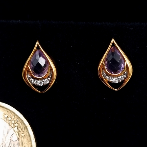 550 - A pair of Amethyst stone and Simmonite 9 carat gold plated stud earrings. Boxed, old new stock.