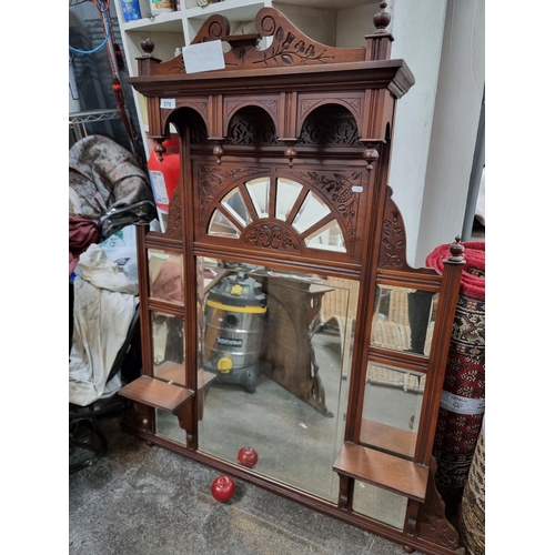 578 - Star Lot : A highly ornate Victorian mahogany over-mantle mirror. Furnished with no less than thirte... 