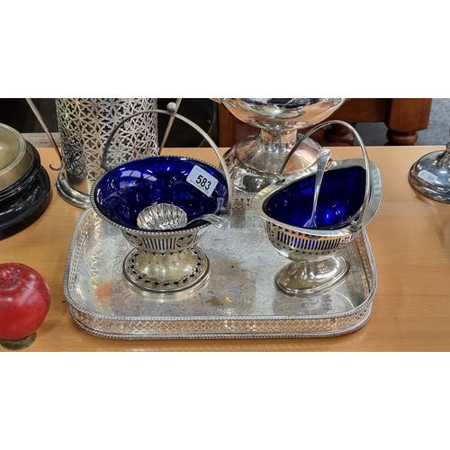 583 - Five vintage silver plated items including two pierced pedestal sugar bowls with blue glass liners. ... 