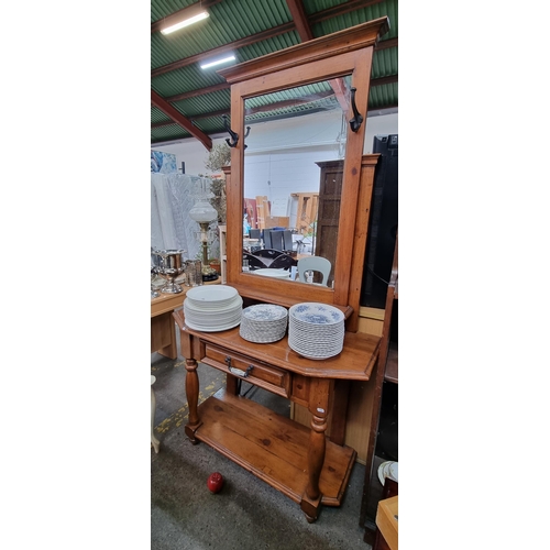 592 - A lovely vintage wooden hall stand with a large mirror to top, flanked by two metal hat hooks. Singl... 