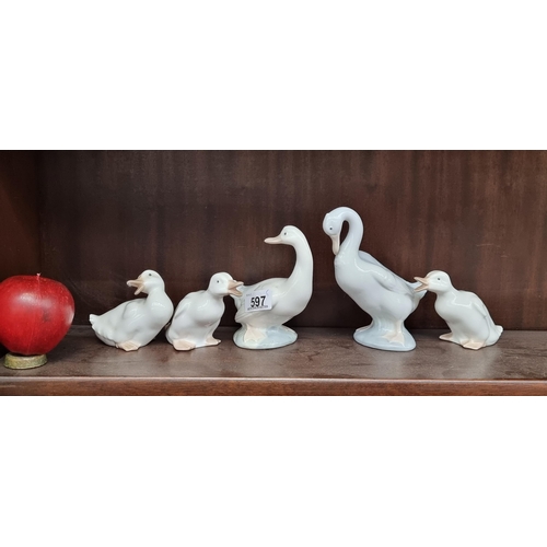 597 - Five Nao by Lladro handmade porcelain runner ducks in a variety of playful poses. Dating to 1985.