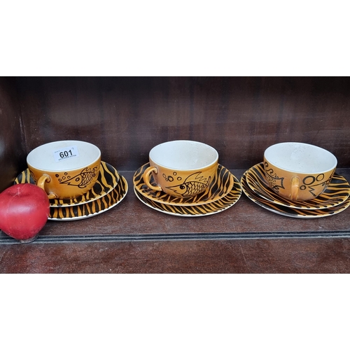 601 - Star lot : Nine pieces of John Ffrench Arklow Studio Pottery including three cups featuring a charmi... 