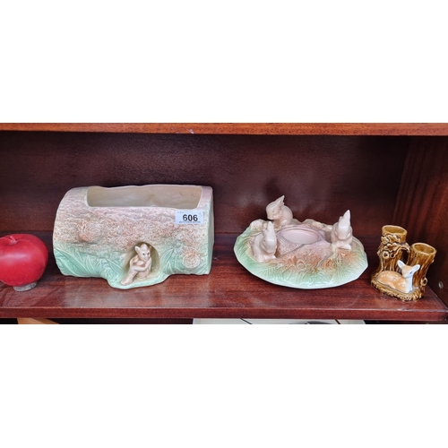 606 - Three ceramic items including two Sylvac items, one vase in the form of wooden log with charming fai... 