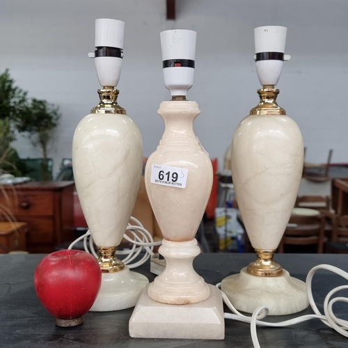 619 - Three heavy marble table lamp bases in a white shade with gilt details.