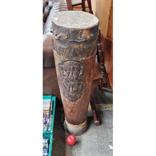 637 - Star lot : An antique large Africa friction drum with a hollow cylindrical body with animal skin str... 