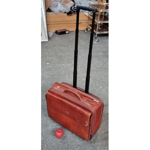 A high quality Condotti luggage compartment trolley bag. Handmade from beautiful soft brown leather