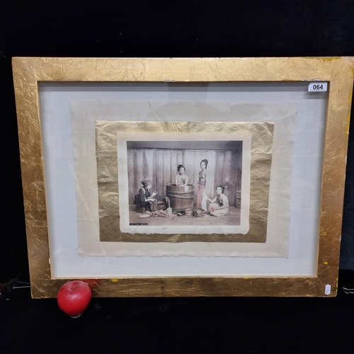 64 - A fabulous antique photograph of four Japanese women bathing titled 