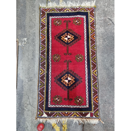 660 - Star lot : A beautiful high quality hand knotted carpet with a vibrant centre panel surrounded by an... 