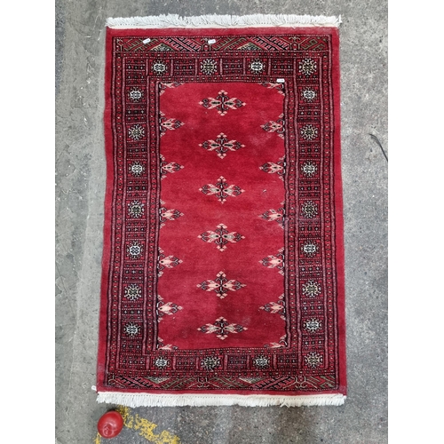 661 - Star lot : A beautiful, very elegant handmade carpet in a rich shade of ruby with an intricately wov... 