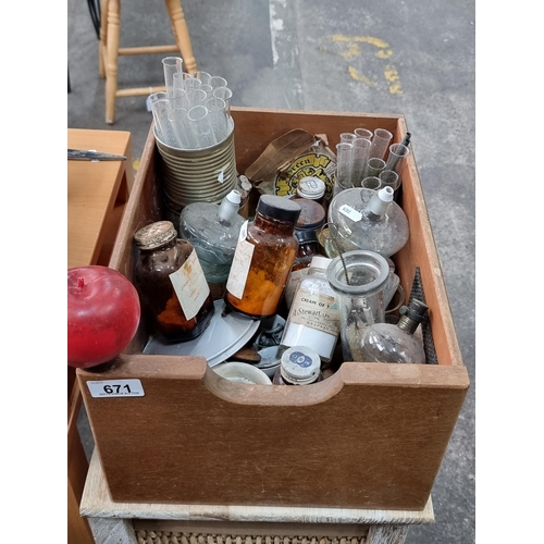 671 - A wooden crate filled with a selection of antique and vintage apothecary bottles, glass vials and ph... 